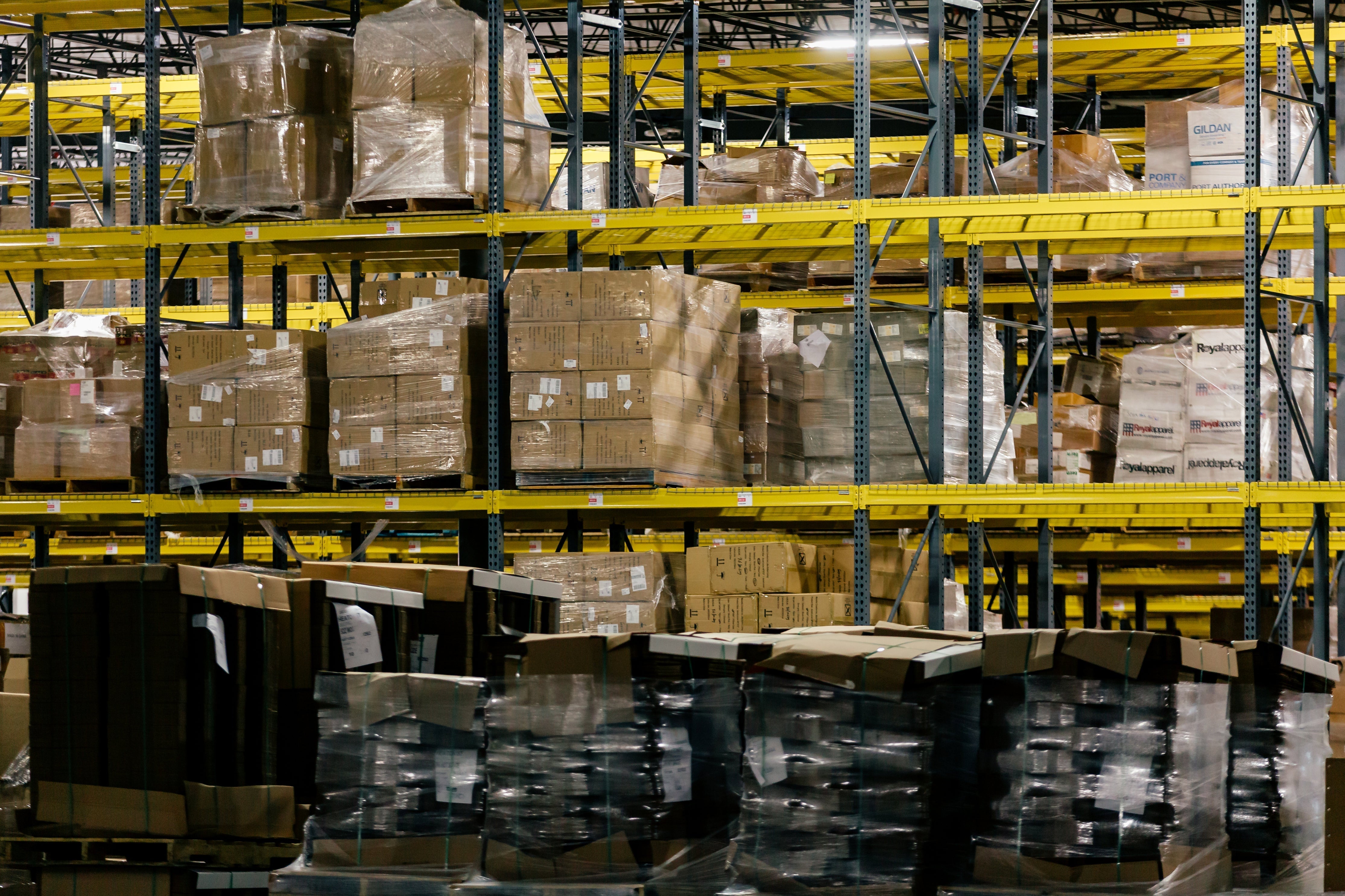 warehouse shelves stacked with boxes ready for fulfillment