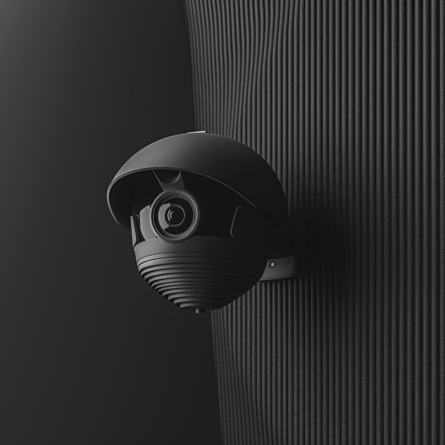 Black wall-mounted surveillance camera