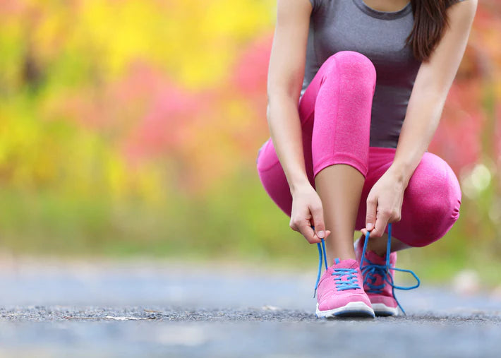 Woman tying her shoelaces