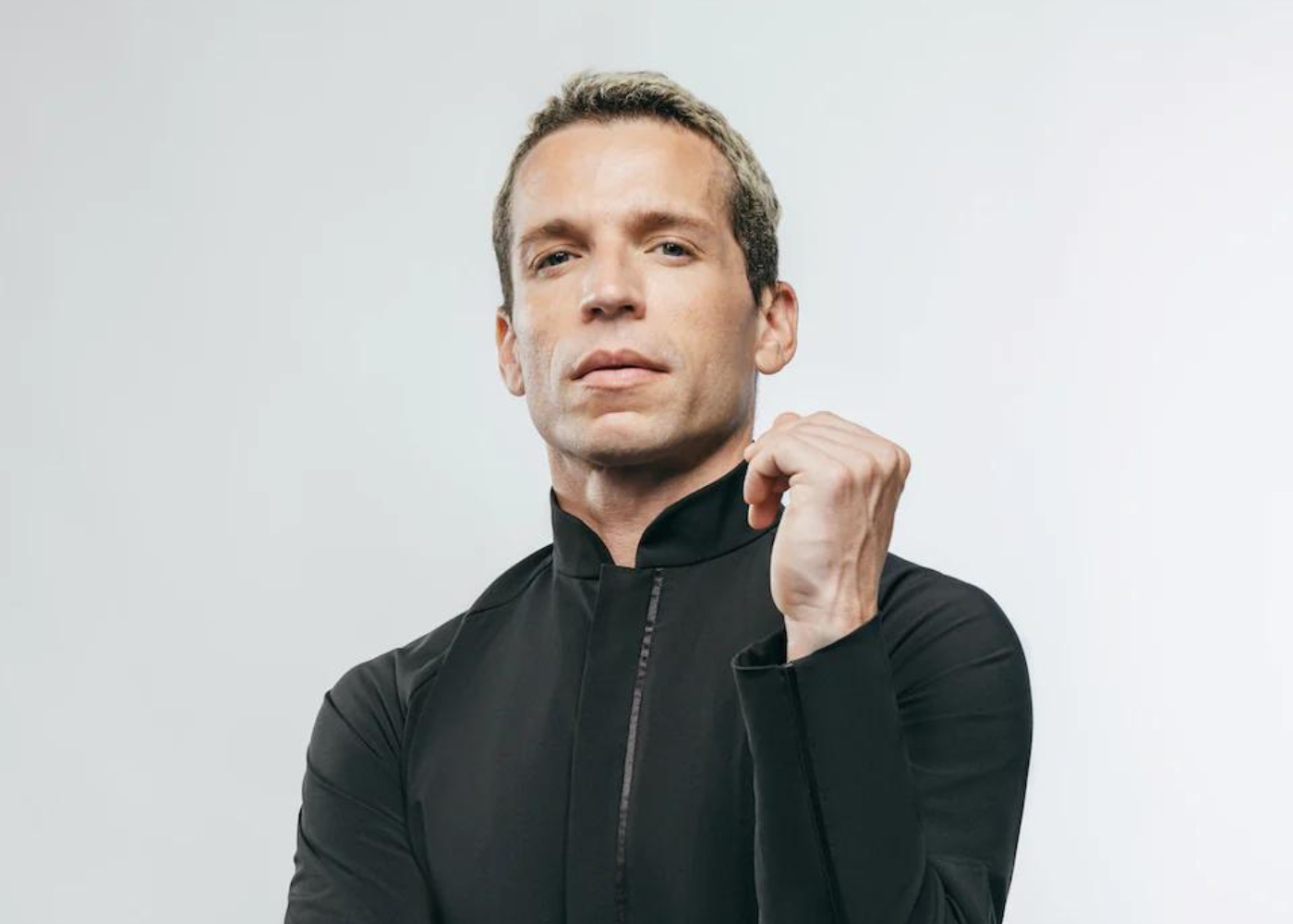 Man in a high-collared long-sleeve shirt