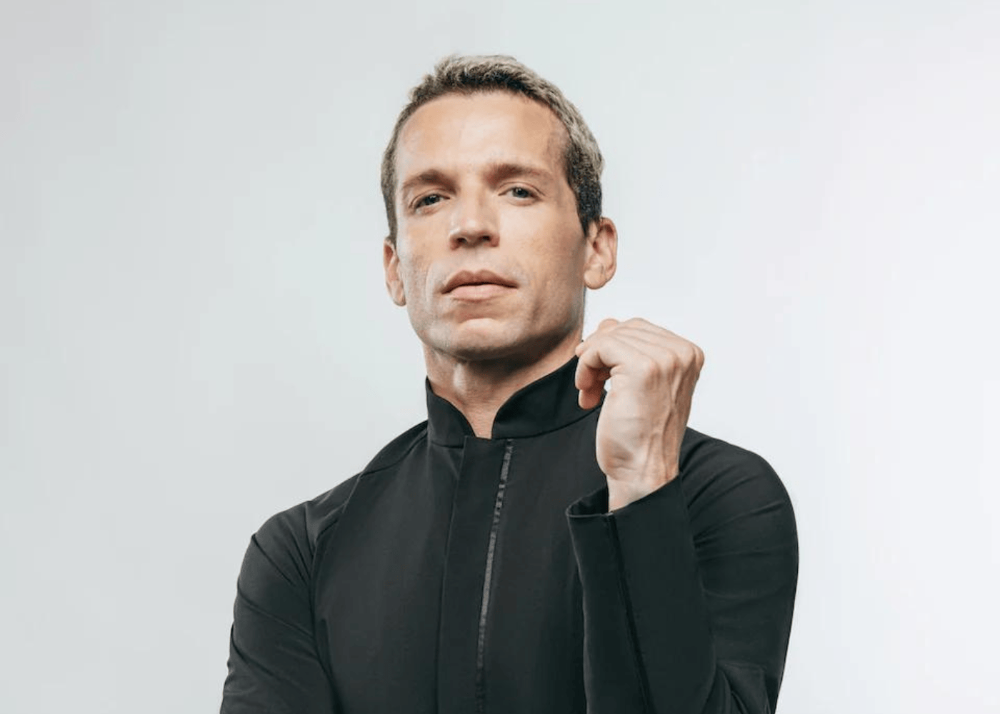 Man in a high-collared long-sleeve shirt