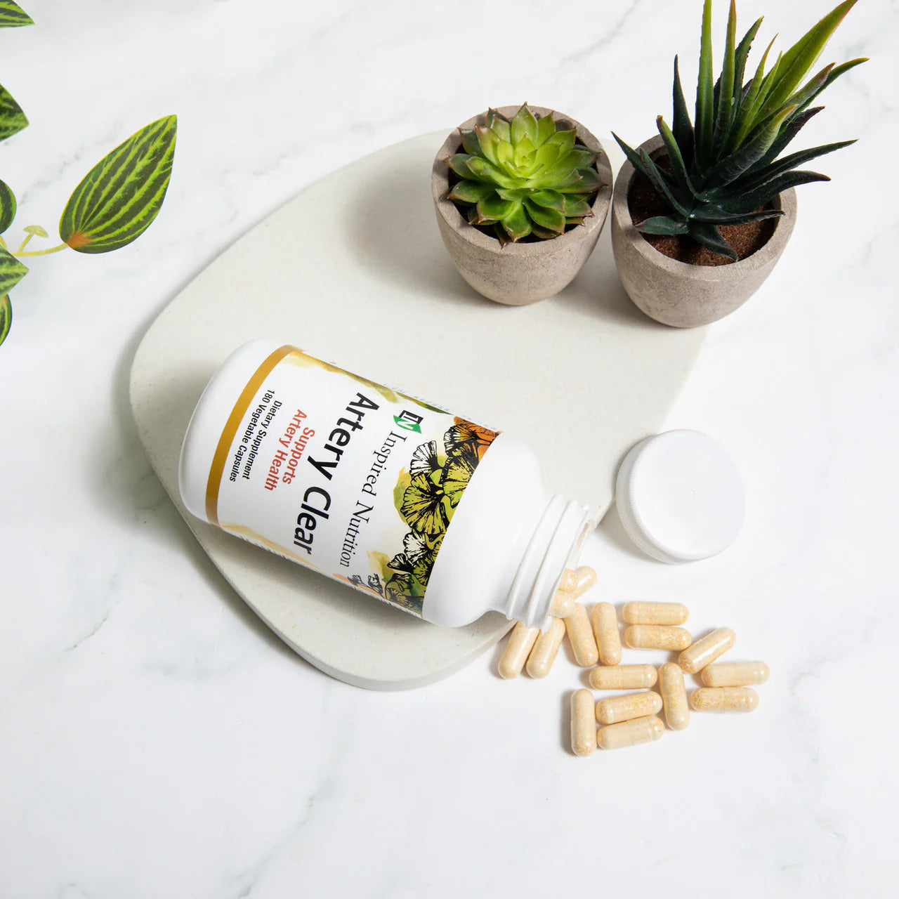 White bottle on its side with supplements spilling out