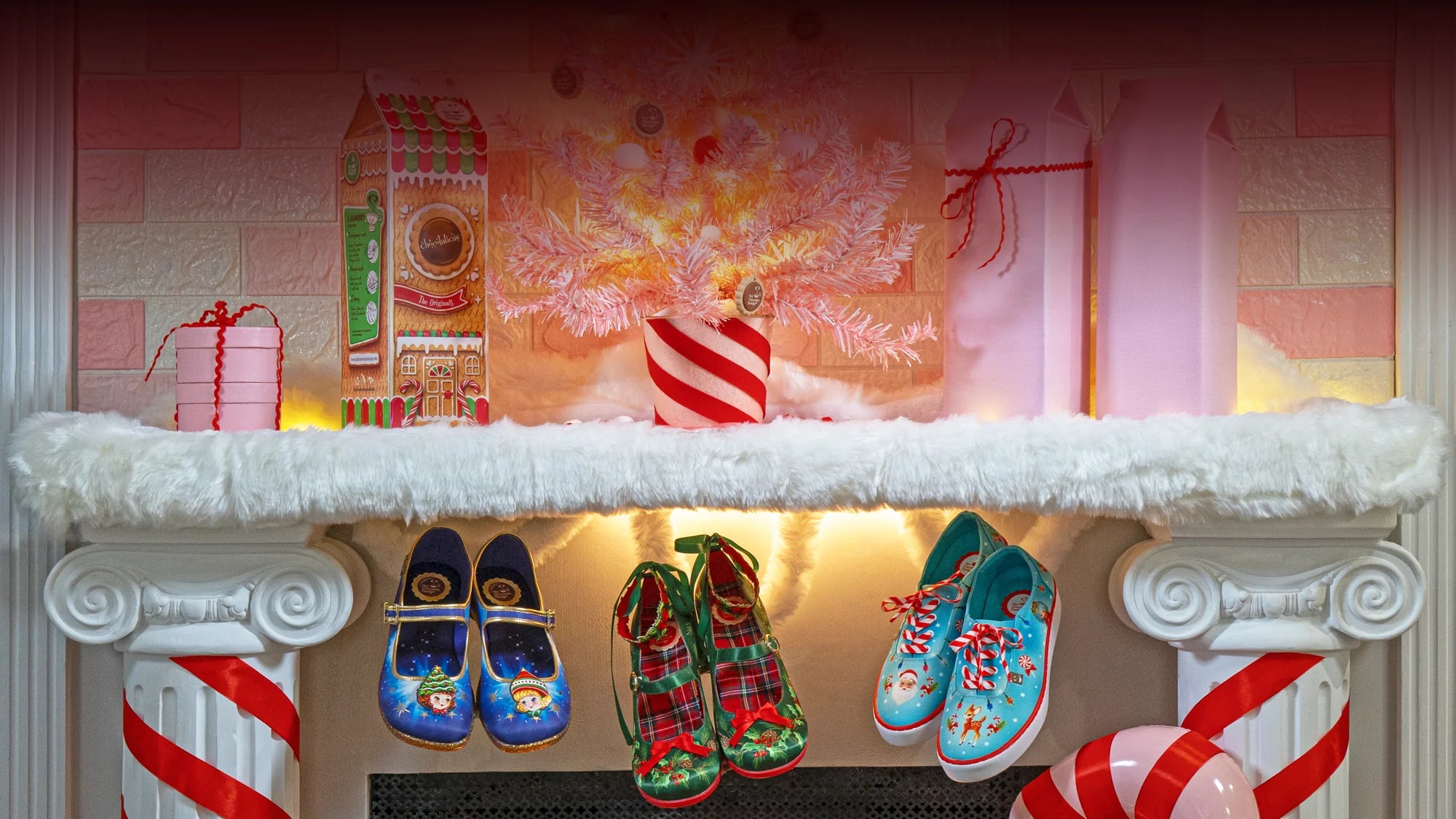 Christmas mantle with hanging Christmas-themed shoes
