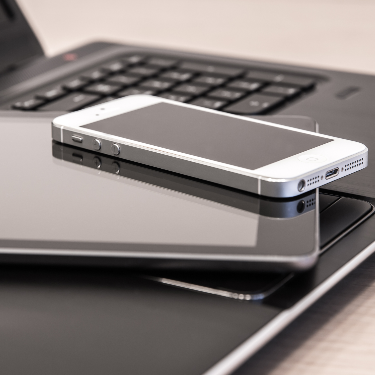Laptop, tablet, and phone stacked