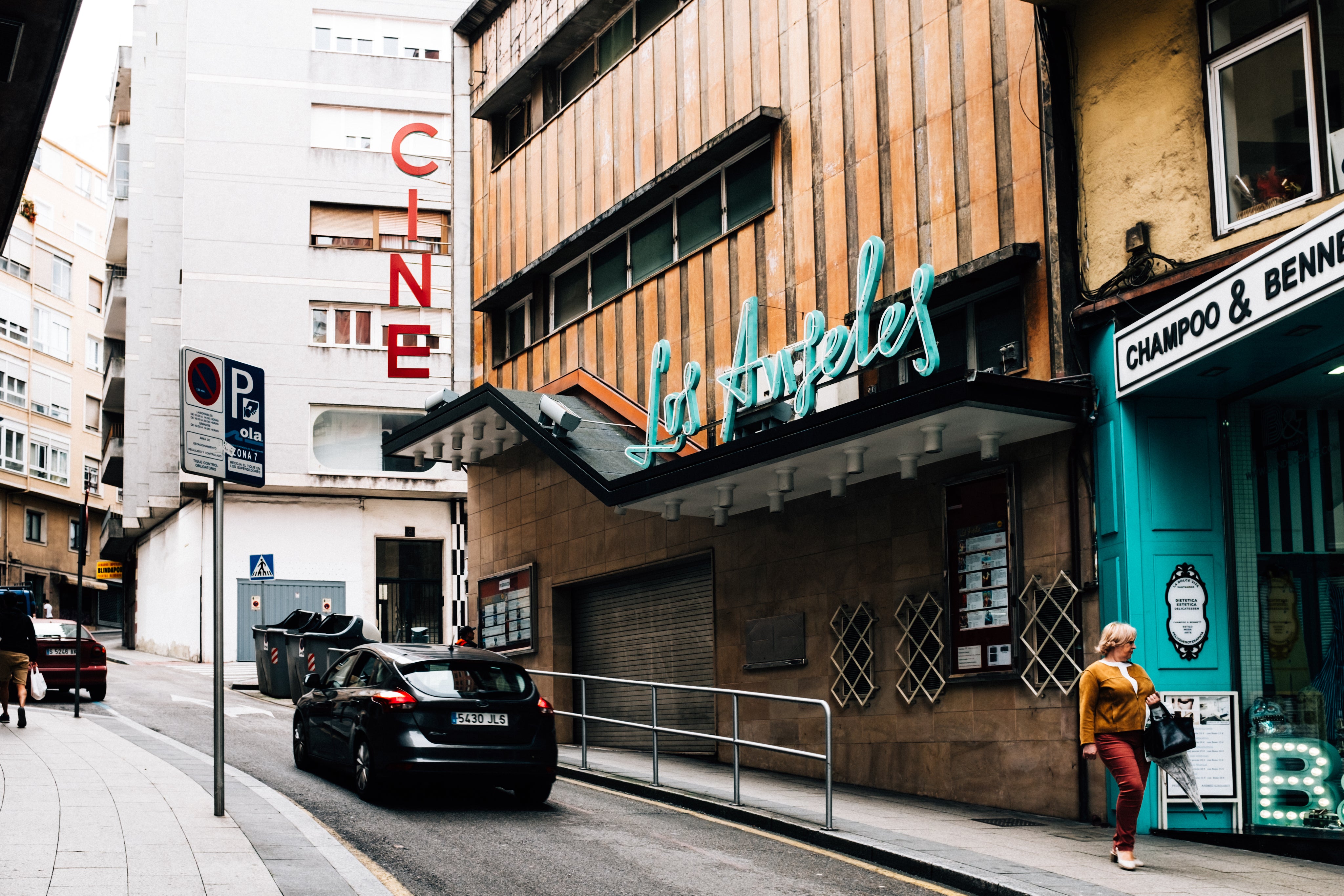 Daytime street with neon signs
