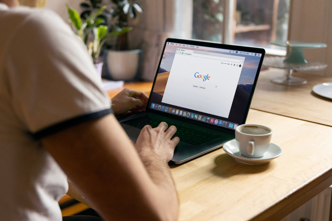 person having coffee and accessing google chrome