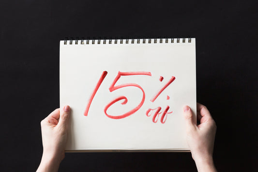 hands holding a 15% off sale
