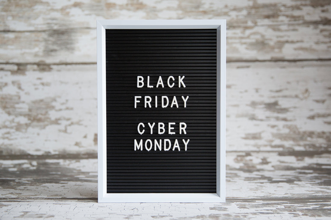 A framed signed with Black Friday Cyber Monday displayed.