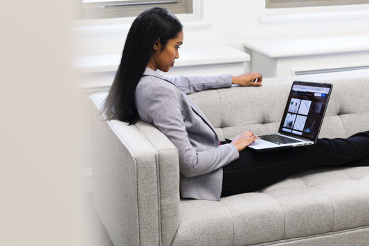 woman with laptop on couch